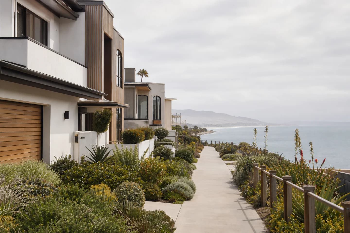 UrbanCove-generated editorial Ventura and Oxnard coastal residential context with modern homes and a planted ocean-facing path; not an exact property or listing