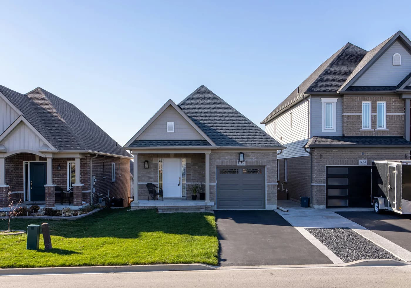 Contextual view of completed homes along a residential street