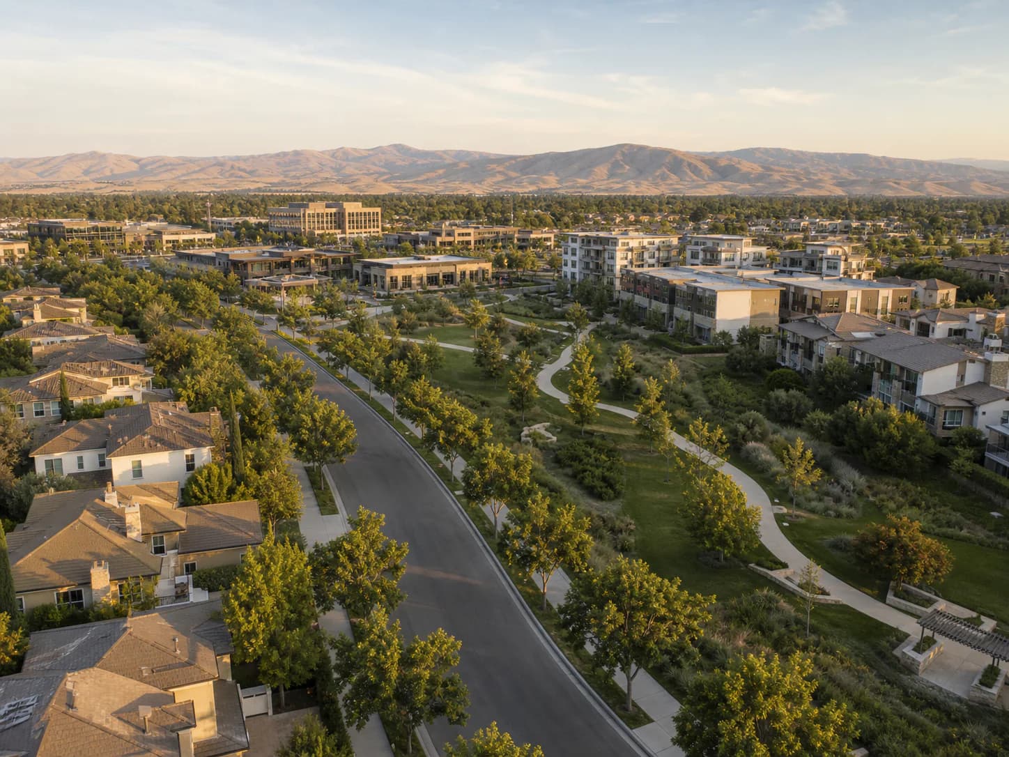 Source-correlated editorial illustration of a broad master-planned residential setting with landscaped corridors, a park, and mixed-use context